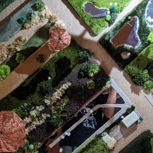 1250呎高的風景決賽模型，陰影由小飛機模型投影，提案時被更改